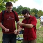 Professor Schwartz demonstrates flint-knapping techniques.